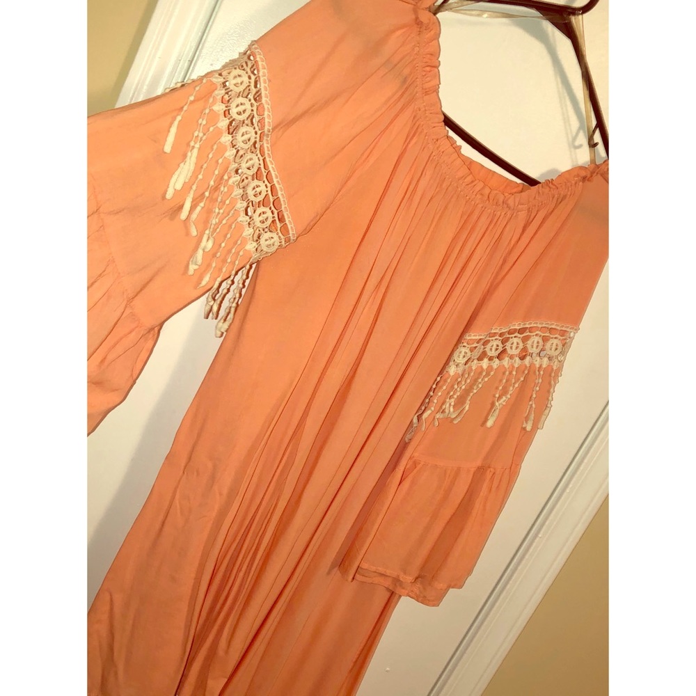 Orange off the shoulder dress.